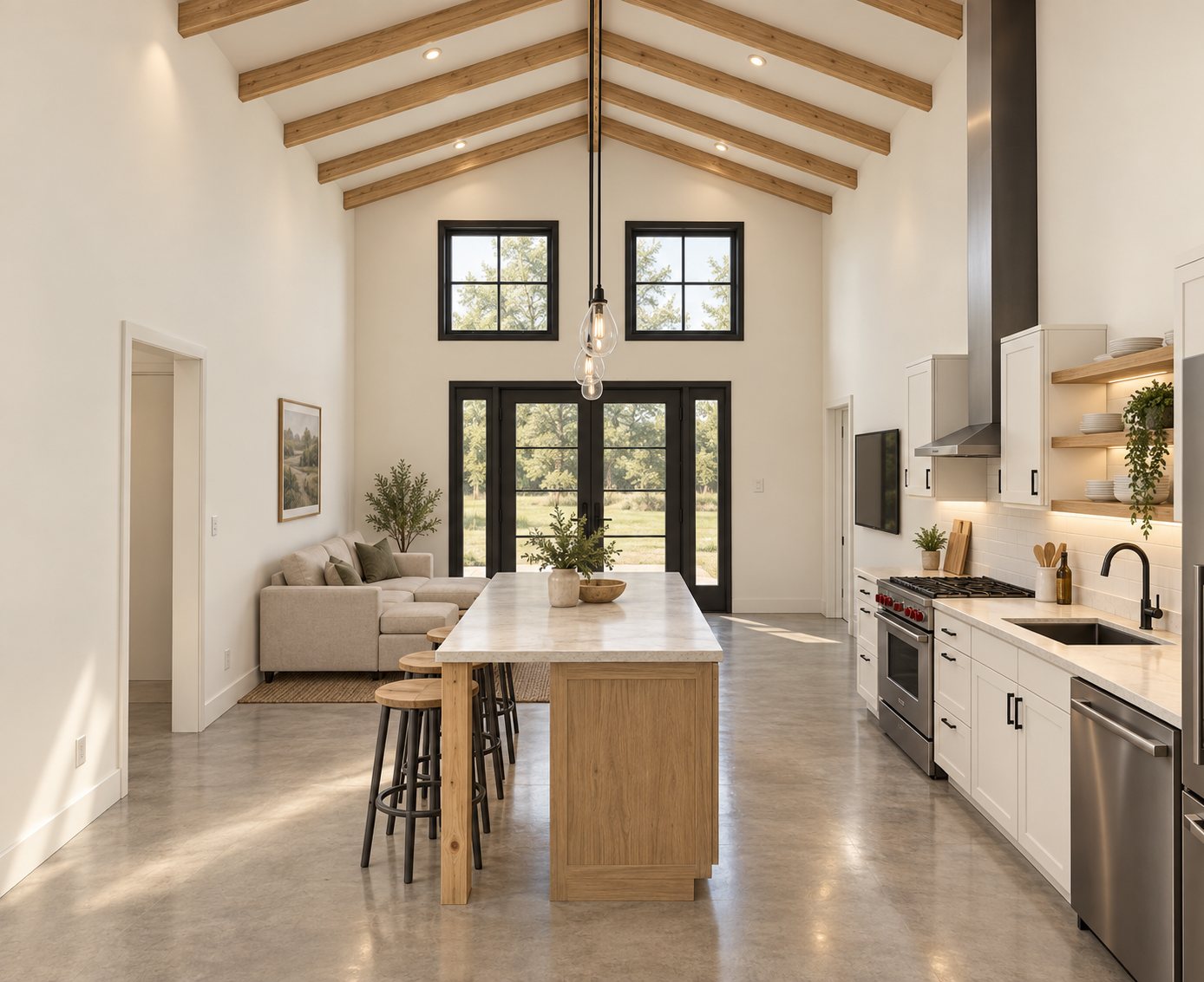 Looking from the kitchen island to the living area and the front doors, with two windows high in the gable wall above.